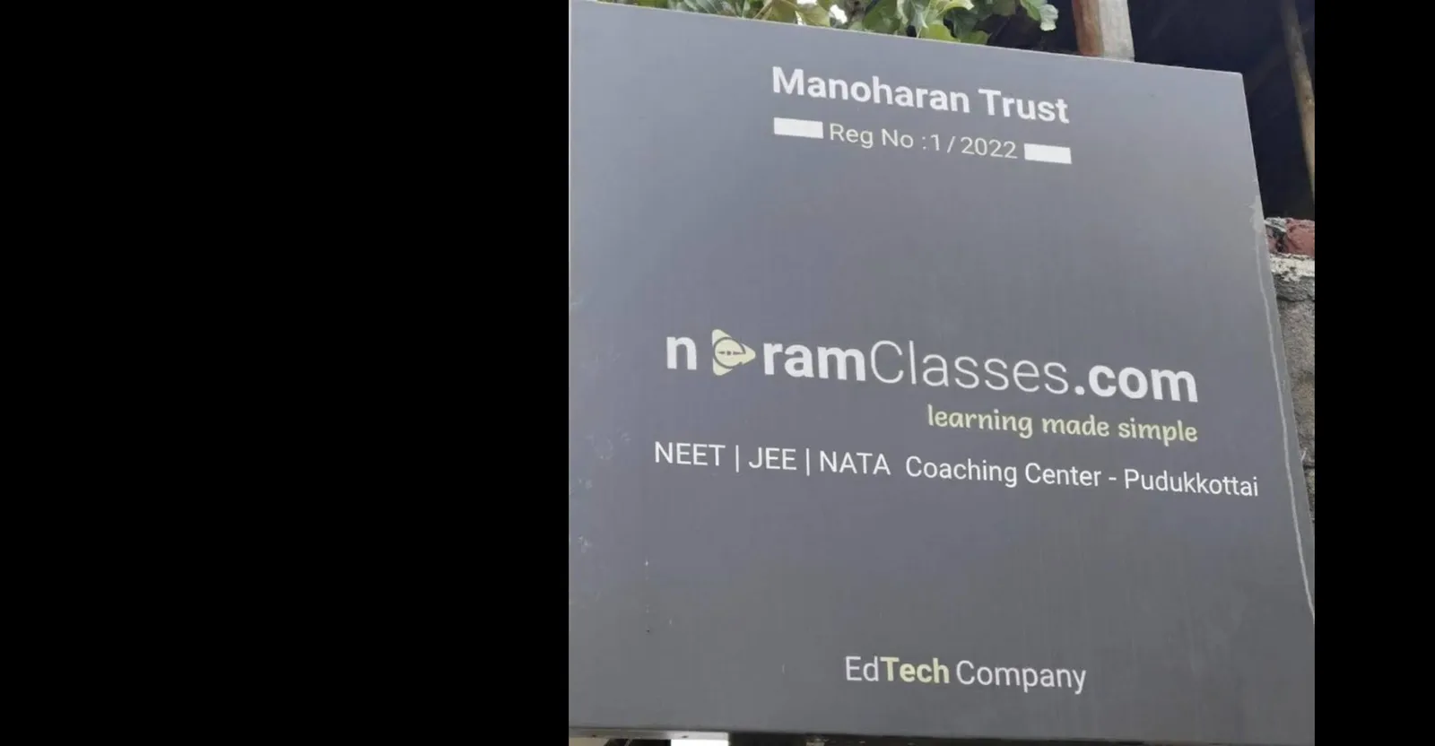 Outside, with the signboard at Neram Classes, Pudukkottai