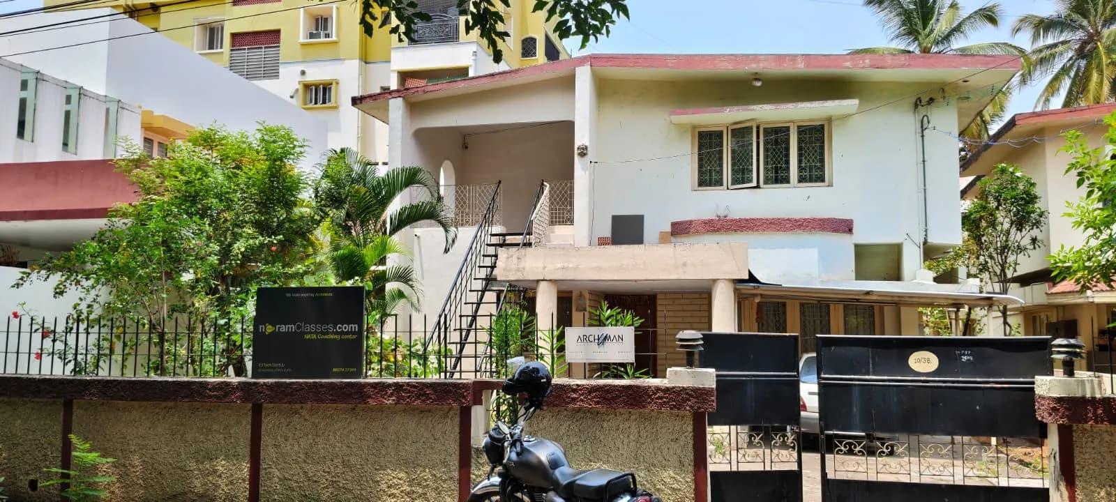 Outside, with the signboard at Neram Classes, Coimbatore